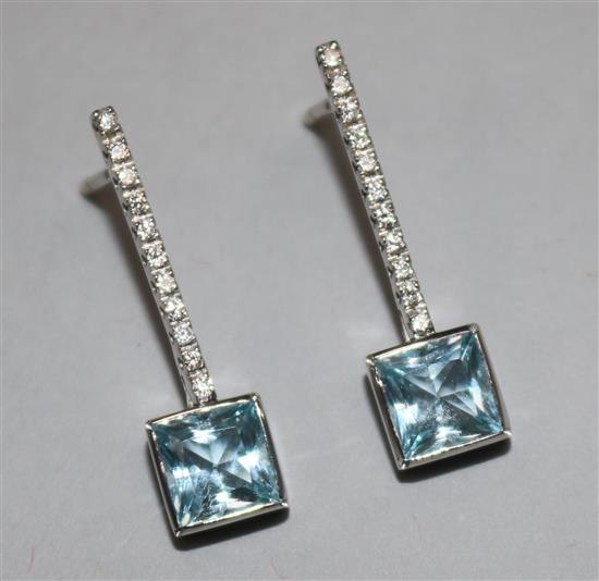 A pair of aquamarine and diamond modernist drop earrings in white metal settings, (one butterfly missing), 26mm.